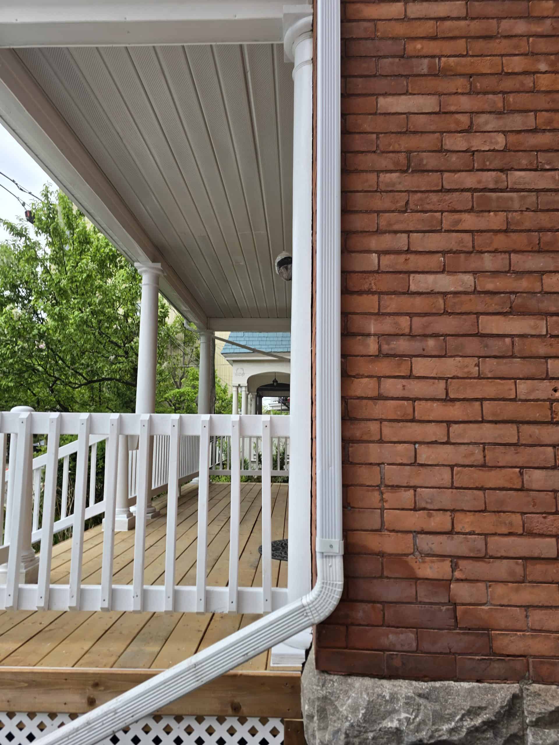 Custom-built porch by MCD Contracting featuring quality wood decking, white railings, and expert craftsmanship that enhances your home’s beauty and durability.