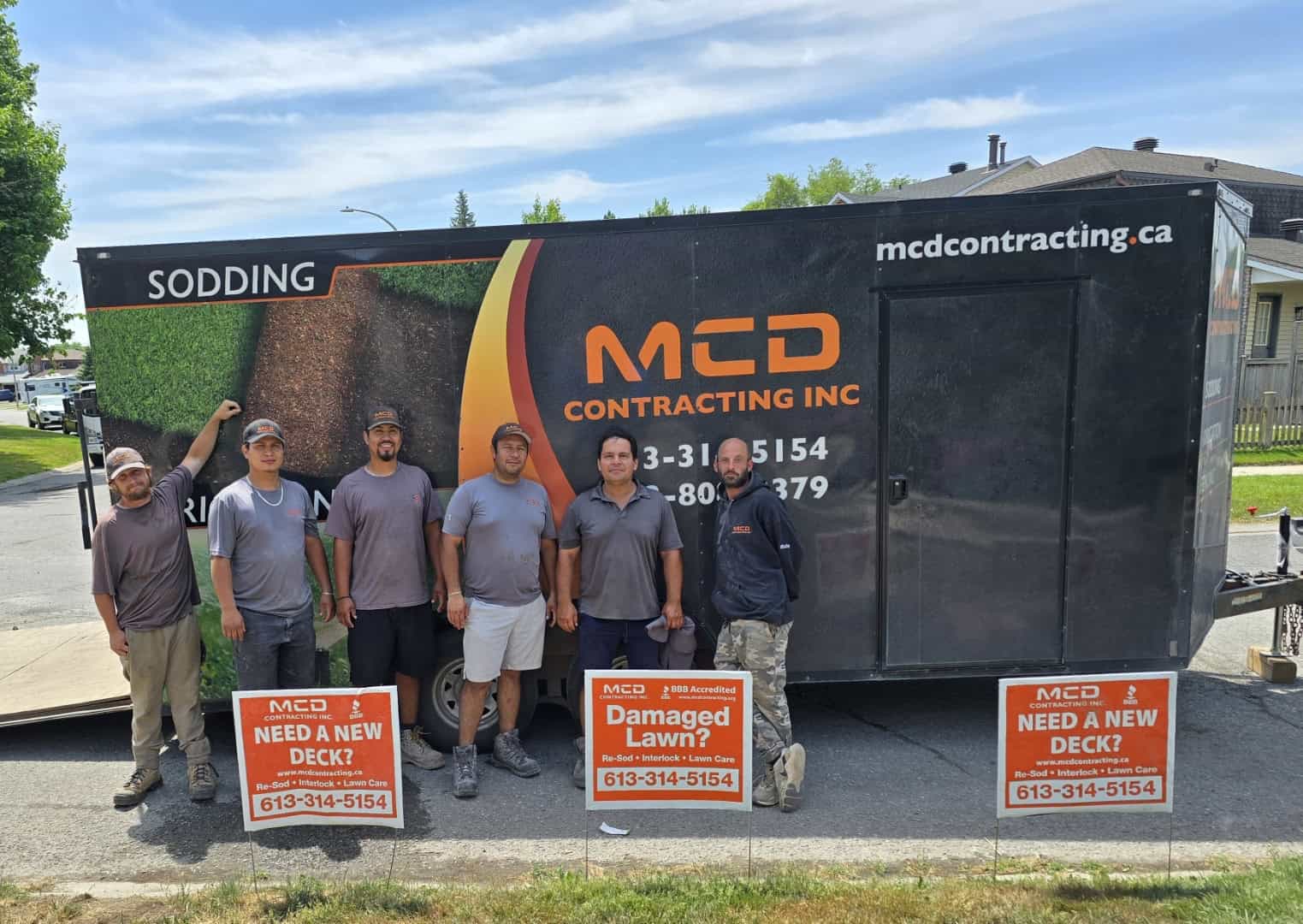 MCD Contracting Team/Branding photo showcasing the six-person crew and mobile advertisement for services like sodding, decks, interlock, and lawn care.