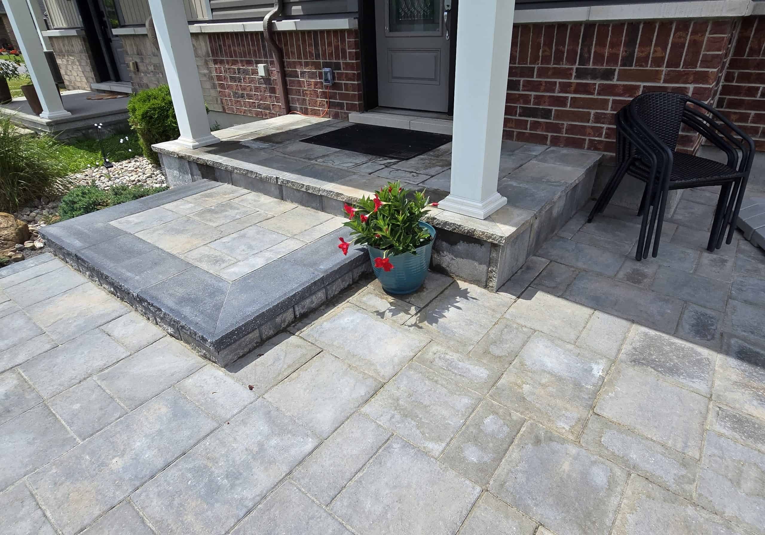 MCD Installed paver entryway. We transformed this entry with new paver steps and a walkway. The dark charcoal border adds contrast to the beautiful, multi-toned stone entryway.