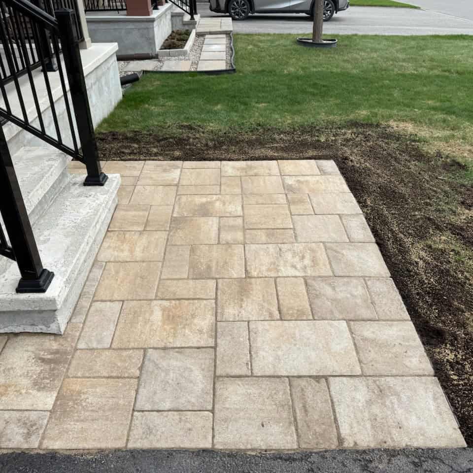 Paver walkway and steps landing Paver walkway and steps landing made of multi-toned interlocking stone. The new installation enhances the home's entrance and complements the modern railing.
